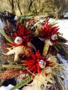 Fall and Christmas wreath with sorghum, wheat, millet, Indian corn, chile pequin, garlic and pinon cones.