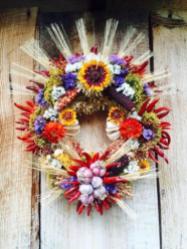 Wreath with many of the popular food crops of New Mexico in celebration of the bounty of the Fall harvest and inspired by the revered and radiating beauty of the Virgen de Guadalupe effigy.